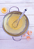 Hollandaise sauce in a mixing bowl (seen from above)