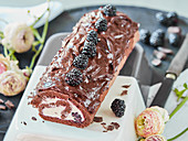 Chocolate Swiss roll with blackberries and ganache