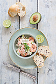 Prawn salad with avocado, cucumber, a light yoghurt cocktail sauce and truffle butter baguette