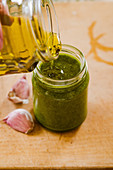 Herb pesto with a layer of oil