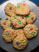 Home made oatmeal cookies with colorful chocolate candies