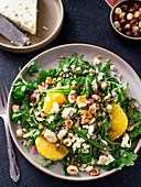 Arugula salad with oranges blue cheese and hazelnuts