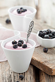 Creamy desserts made with blackcurrants, cottage cheese and vanilla