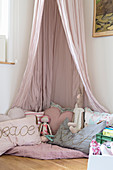 Cosy corner in pink with canopy in girl's bedroom