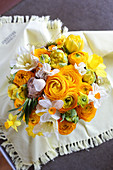 Opulent spring bouquet of ranunculus, tulips and narcissus