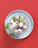 Cod ceviche with red onions and fresh coriander