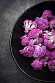 A bowl of organic purple cauliflower