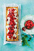 Orange ricotta tart with vanilla-roasted strawberries
