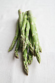 Green asparagus on a linen cloth