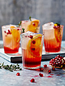 Orange and pomegranate mocktails with thyme