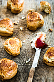Heart-shaped scones with cream cheese and strawberry jam