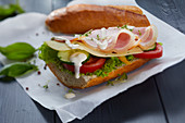 A sandwich with ham, cheese, mayonnaise and cress