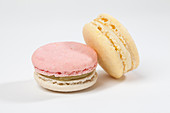 Two macarons against a white background (close up)