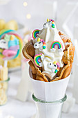 A bubble waffles with frozen yoghurt decoration with rainbows and unicorns