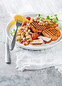 Paprika-grilled pork chops with tomato-braised beans