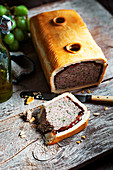 A pork pie with port wine jelly in shortcrust pastry