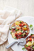 Cauliflower pizza with cherry tomatoes, mushrooms and bocconcini (Low Carb)