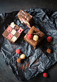 Strawberry, banana and chocolate cake with dark chocolate icing and sponge pralines (vegan)