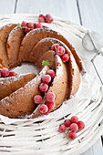 A wreath cake with redcurrants