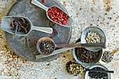 A still life with different types of pepper (top view)
