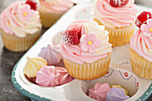 Vanilla and raspberry cupcakes with cream cheese frosting
