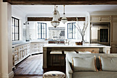 Open kitchen with island and antique chandeliers