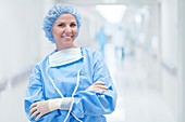 Female surgeon in scrubs smiling