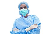 Female surgeon in scrubs and mask