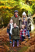 Family in woods in Autumn