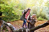 Family playing on tree