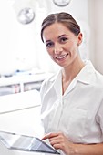 Female doctor using tablet