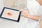 Female medical professional using tablet