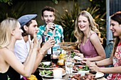 Group of friends eating lunch outdoors