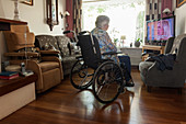 Elderly woman watching television