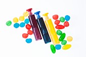 Three containers with coloured liquid spots