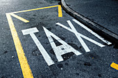 Taxi stand imprint on asphalt road