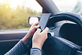 Woman driving and texting