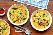 Chicken chowder with potatoes, spinach and corn
