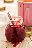 Raspberry jam in a glass jar