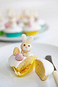 Easter cupcakes with marzipan bunnies and chocolate eggs