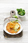 A rosti with a pear, cheese and lamb's lettuce