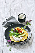 A socca wrap with goat's cheese and avocado
