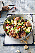 Meatballs with teriyaki vegetables and cashew nuts