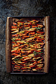 Roasted vegetables (carrots, potatoes) on a baking tray