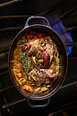 Braised leg of lamb with carrots and onions