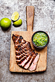 Grilled flank steak with green tomato salsa