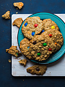 Oatmeal cookies with colorful chocolate candies. Top view