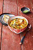 Savoy cabbage, celery, and white bean stew with bread (Tuscany, Italy)