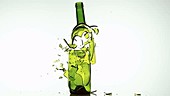 Wine bottle shattering, slow motion