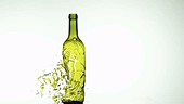 Wine bottle shattering, slow motion